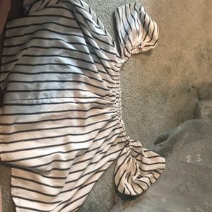 Sleeveless black and white top.